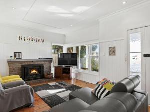 a living room with a couch and a fireplace at Munday Street Prime 17 in Torquay