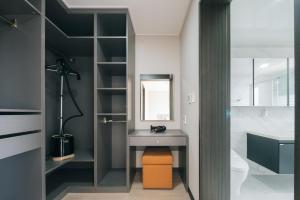 a bathroom with a sink and a mirror at Kylin Villa resort Jeju in Seogwipo
