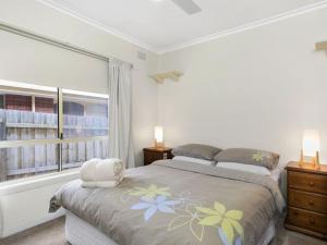 a bedroom with a bed and a window at Francis Geelong 156 in Belmont