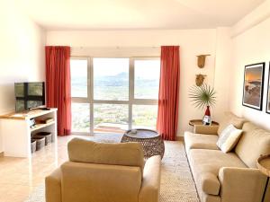 Televízia a/alebo spoločenská miestnosť v ubytovaní Jávea Apartment Mar