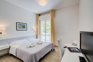 Postel nebo postele na pokoji v ubytování Hotel Ivano + 37 fotografií