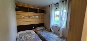 Ένα ή περισσότερα κρεβάτια σε δωμάτιο στο Cabañas las Rosas