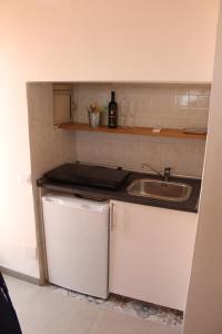 Kuchyň nebo kuchyňský kout v ubytování Margiò House + 37 fotografií