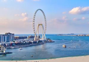 a large body of water with a bridge over it at Ramada Hotel and Suites by Wyndham Dubai JBR in Dubai