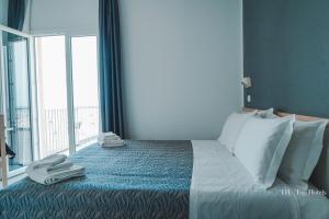 Postel nebo postele na pokoji v ubytování Nautic Beach Hotel