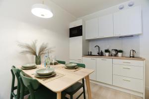 Η κουζίνα ή μικρή κουζίνα στο M&K Apartamenty Cztery Brzozy - Wyspa Sobieszewska