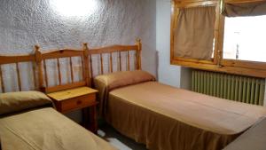 Postel nebo postele na pokoji v ubytování Pensión Rural Arroyo la Teja