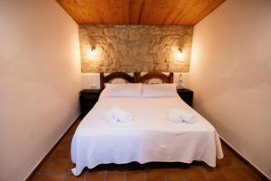 Postel nebo postele na pokoji v ubytování Hospedium Hotel La Parada del Compte