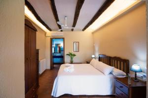 Postel nebo postele na pokoji v ubytování Hospedium Hotel La Parada del Compte