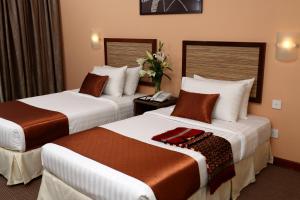 Кровать или кровати в номере TH Hotel Kelana Jaya
