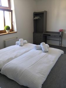 Postel nebo postele na pokoji v ubytování Městské kulturní centrum ve Fulneku