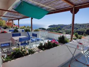a view from the balcony of a house with a table and chairs at Elba Residence in Capoliveri
