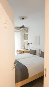 Giường trong phòng chung tại 262 Baixa Guesthouse