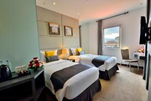 Postel nebo postele na pokoji v ubytování Serela Merdeka by KAGUM Hotels + 37 fotografií
