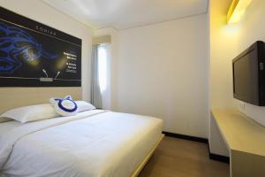 Een TV en/of entertainmentcenter bij Zodiak Paskal by KAGUM Hotels

