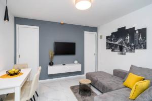a living room with a couch and a table at Luxury Downtown West Apartment Dubrovnik in Dubrovnik