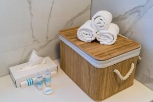 a wooden box with towels on top of a toilet at Luxury Downtown West Apartment Dubrovnik in Dubrovnik +34 photos