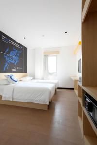 Een bed of bedden in een kamer bij Zodiak Paskal by KAGUM Hotels