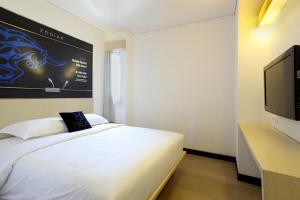 Een bed of bedden in een kamer bij Zodiak Paskal by KAGUM Hotels