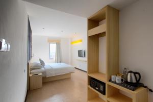 Een bed of bedden in een kamer bij Zodiak Paskal by KAGUM Hotels