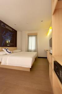 Een bed of bedden in een kamer bij Zodiak Paskal by KAGUM Hotels