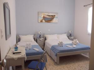 Tempat tidur dalam kamar di Giasemi rooms