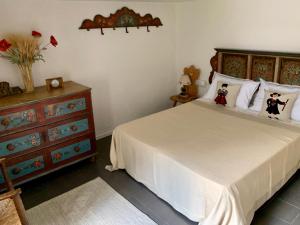 A bed or beds in a room at Casa Curti