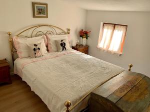 A bed or beds in a room at Casa Curti