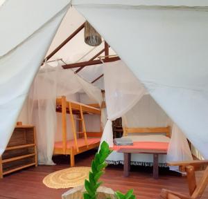 A bed or beds in a room at Glamping Algodões
