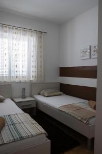 Ένα ή περισσότερα κρεβάτια σε δωμάτιο στο Apartment Novalja