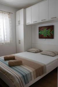 Ένα ή περισσότερα κρεβάτια σε δωμάτιο στο Apartment Novalja