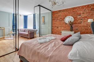 Posteľ alebo postele v izbe v ubytovaní Warzywnicza Old Town Apartment