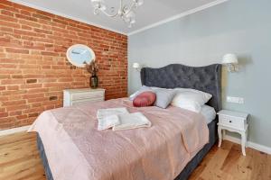 Posteľ alebo postele v izbe v ubytovaní Warzywnicza Old Town Apartment