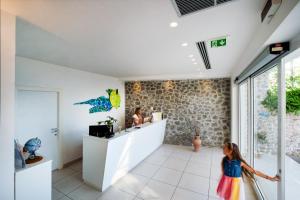 a room with a counter and a doll in the middle at Relais Manfredi in Castellammare di Stabia +175 photos