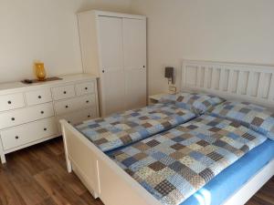 Posteľ alebo postele v izbe v ubytovaní Apartmány 27