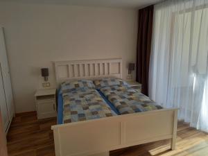 Posteľ alebo postele v izbe v ubytovaní Apartmány 27