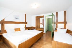 Postel nebo postele na pokoji v ubytování Hotel Alt Bamberg