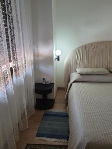 A bed or beds in a room at Sole D'oro IUN S4354