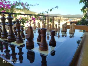 a close up of a chess board with chess pieces at meltem pansiyon in Kas