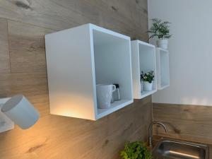 Kuchyň nebo kuchyňský kout v ubytování Apartmány LUXOR