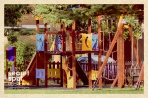a playground with a slide in a park at Secret Spot Apartment - Quinta da Barca in Esposende