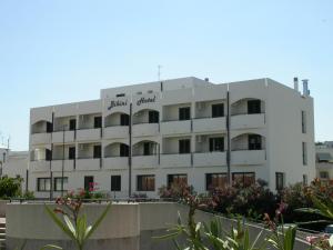 a white building with the words embassy garden on it at Bikini Hotel in Vieste