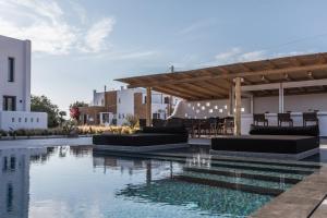 a swimming pool in the middle of a building at Naxian Secret in Naxos Chora