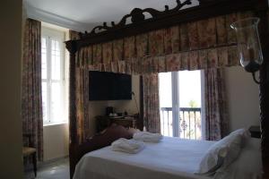 TV a/nebo společenská místnost v ubytování Hotel Playa de Regla