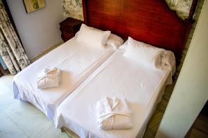 Postel nebo postele na pokoji v ubytování Hotel Playa de Regla