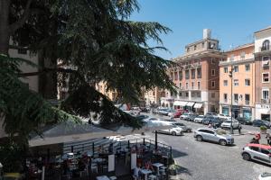 a city street with cars parked in a parking lot at Antica Terrazza Frascati in Frascati