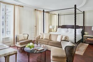 a living room filled with furniture and a large window at Mandarin Oriental, Ritz Madrid in Madrid