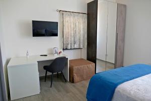 Postel nebo postele na pokoji v ubytování B&B LE MAGNOLIE