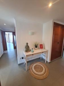 a living room with a table and a rug at Moraira Beach in Moraira