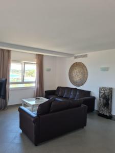 a living room with a couch and a table at Moraira Beach in Moraira